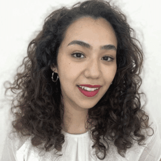 Fátima Alonso Hernández smiling at the camera against a white background.